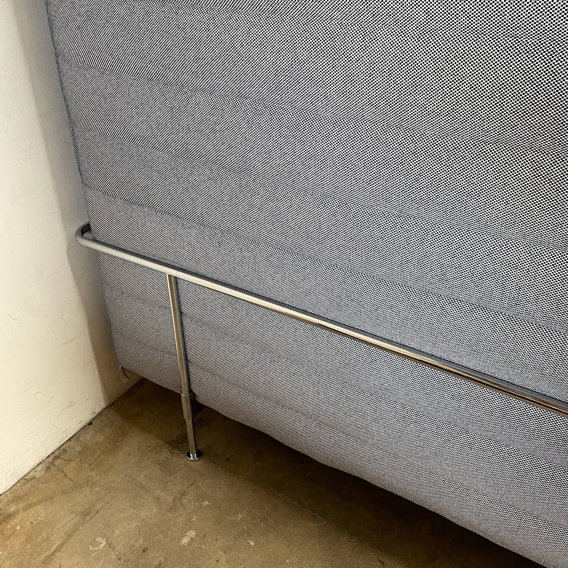 A set of comfortable and modular Vitra Alcove Cabin chairs with a table in the middle.