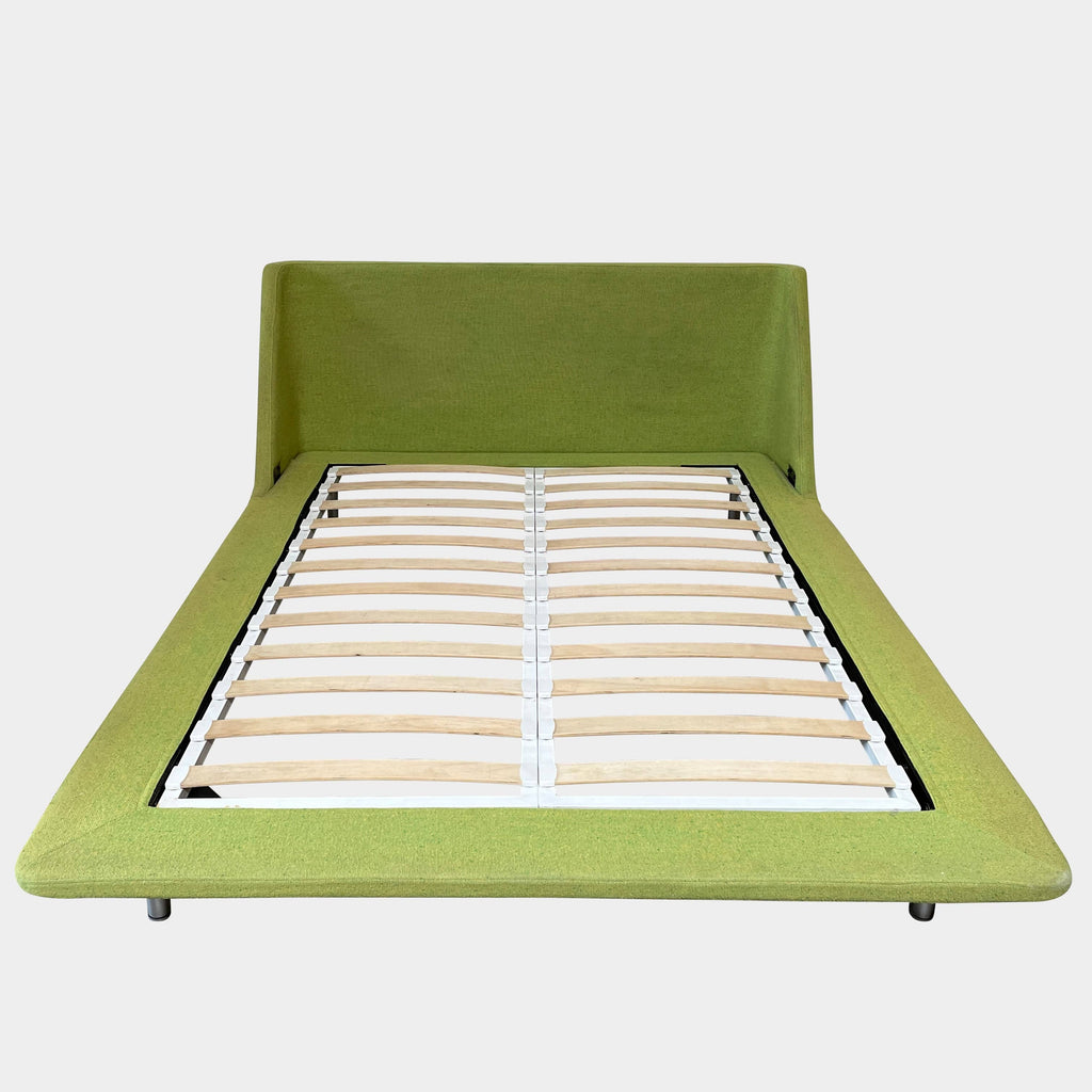A contemporary Blu Dot Nook Queen Size Bed frame with a wooden slatted base in a green color enhanced by Blu Dot's innovative design.