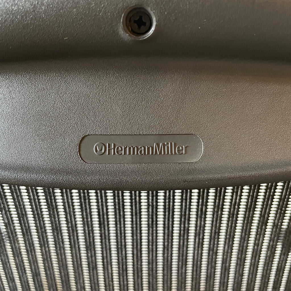A breathable fabric Herman Miller Aeron Office Chair by Herman Miller on a white background.