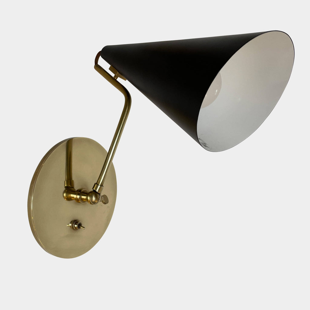The Visual Comfort Clemente Sconce Set is an elegant wall lamp featuring a stylish combination of black and gold accents. Its white shade adds a touch of sophistication to any room. The lamp showcases an