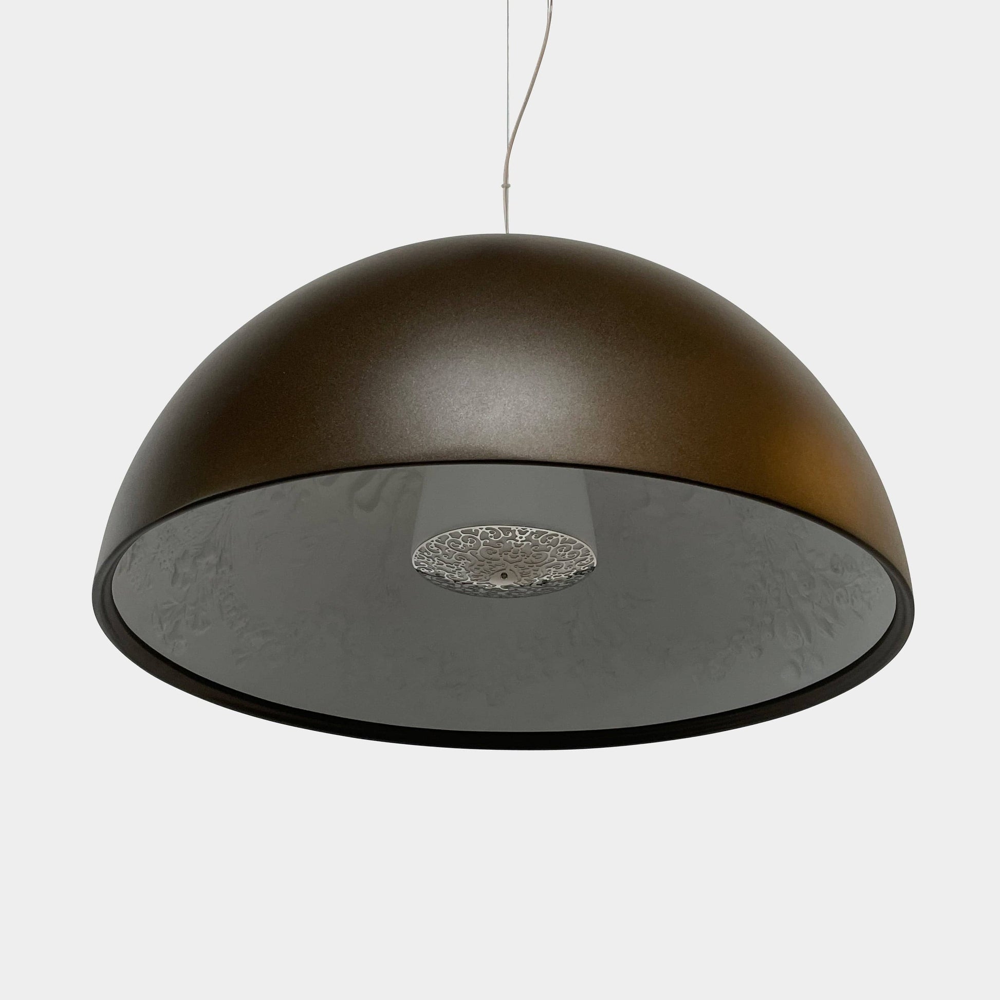 An ornate Flos Skygarden Suspension Light: Matte Rusty Brown pendant light with an interior shade.