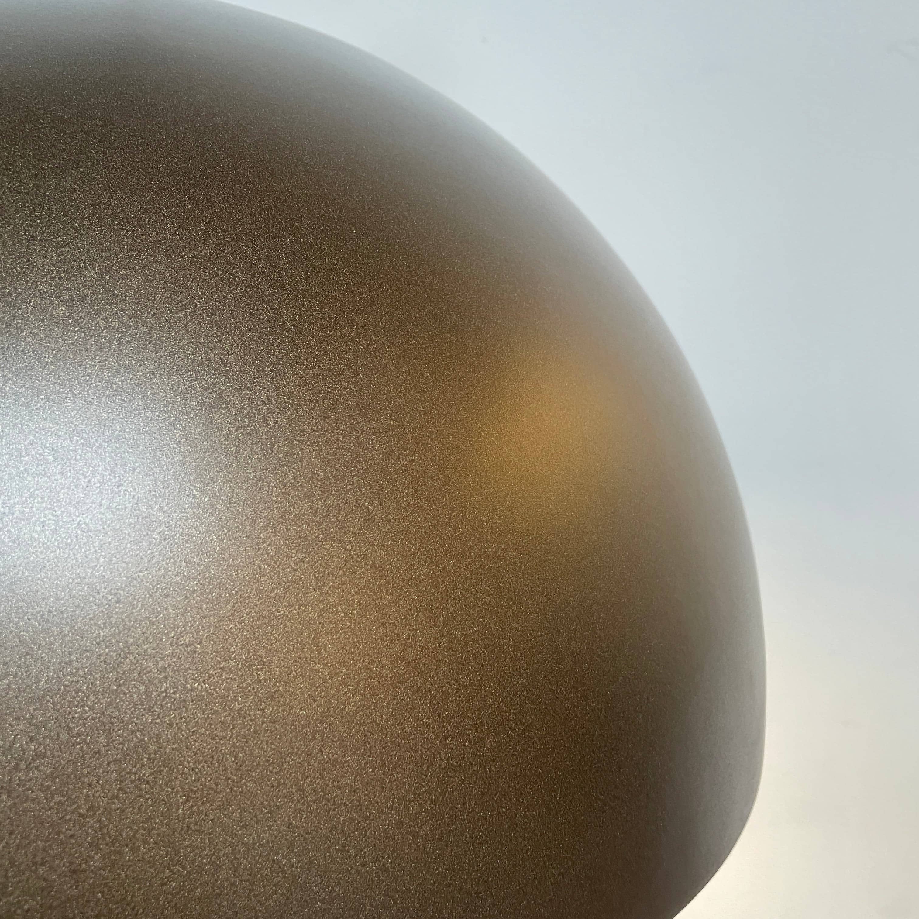 An ornate Flos Skygarden Suspension Light: Matte Rusty Brown pendant light with an interior shade.