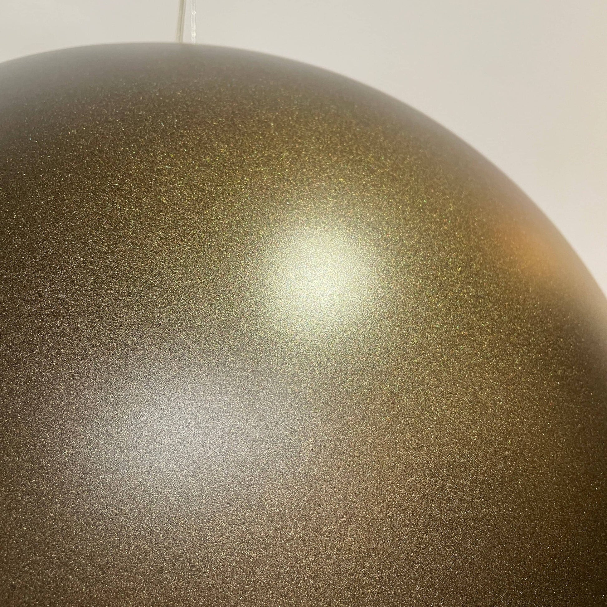 An ornate Flos Skygarden Suspension Light: Matte Rusty Brown pendant light with an interior shade.