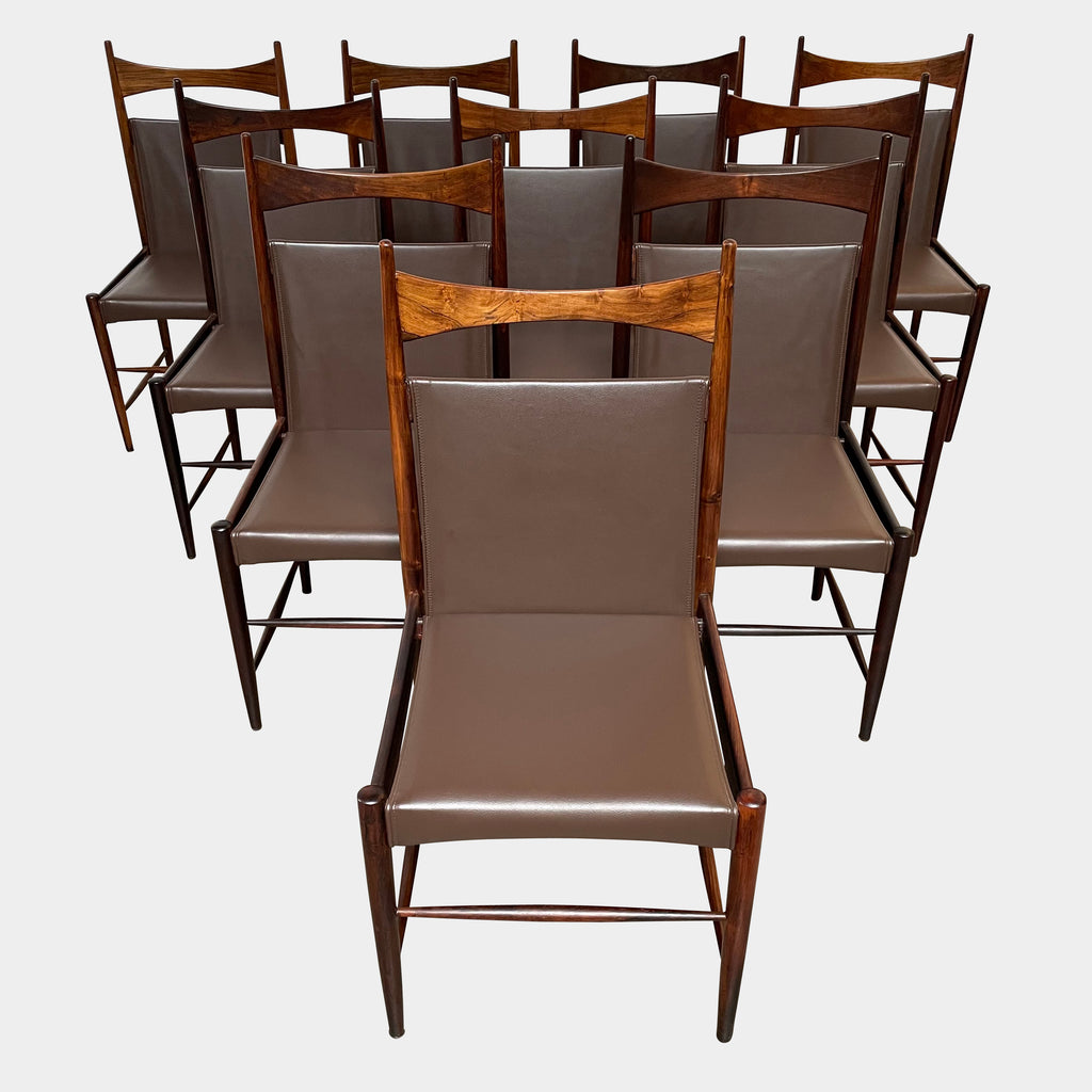 A set of Sergio Rodrigues Cantu High Dining Chairs with brown leather seats.