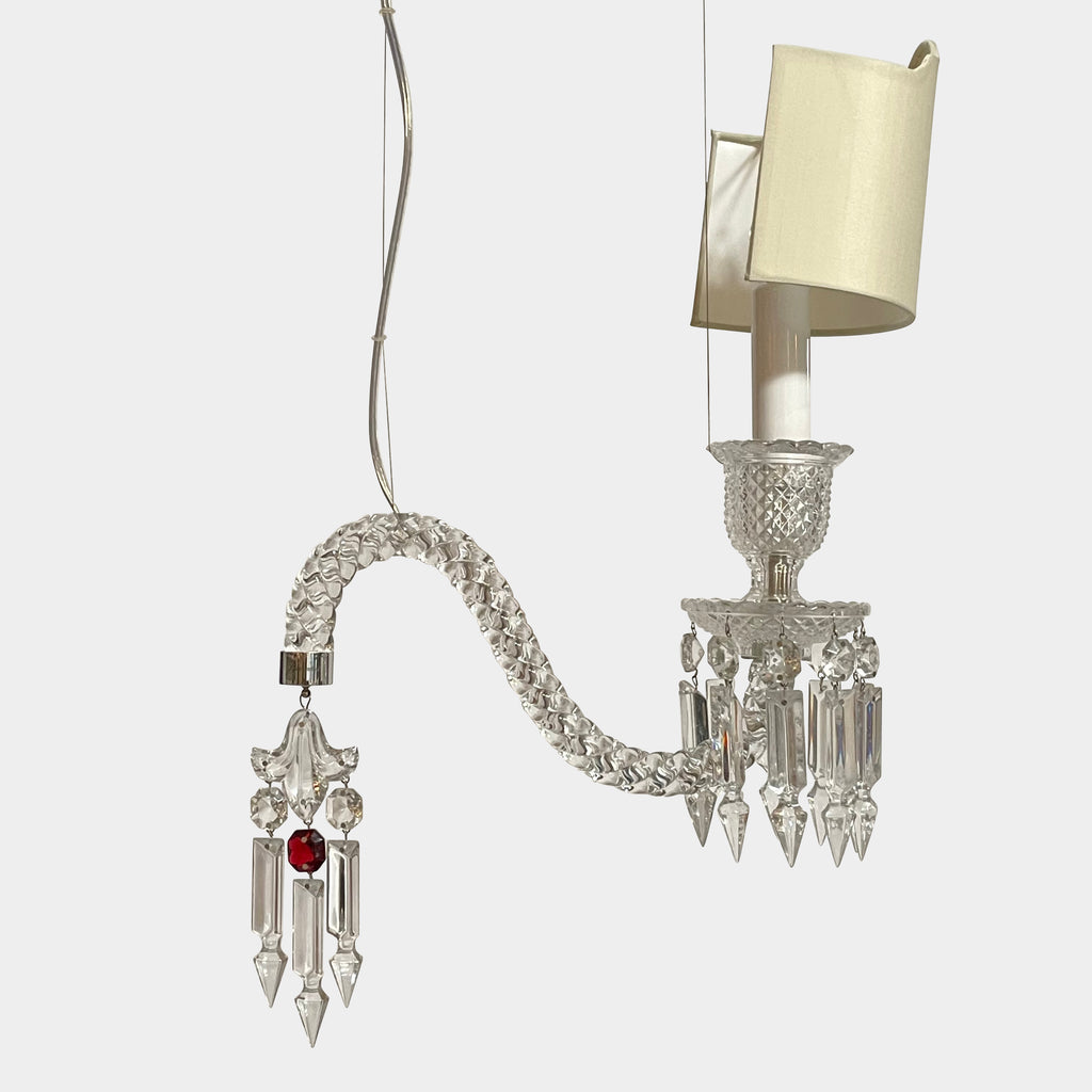 A Baccarat Fantome Ceiling Lamp with a glass shade and a red lamp.
