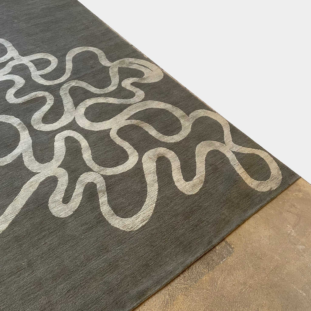 A Delinear Andy rug featuring swirls in grey and white colors, crafted from Himalayan wool and silk.