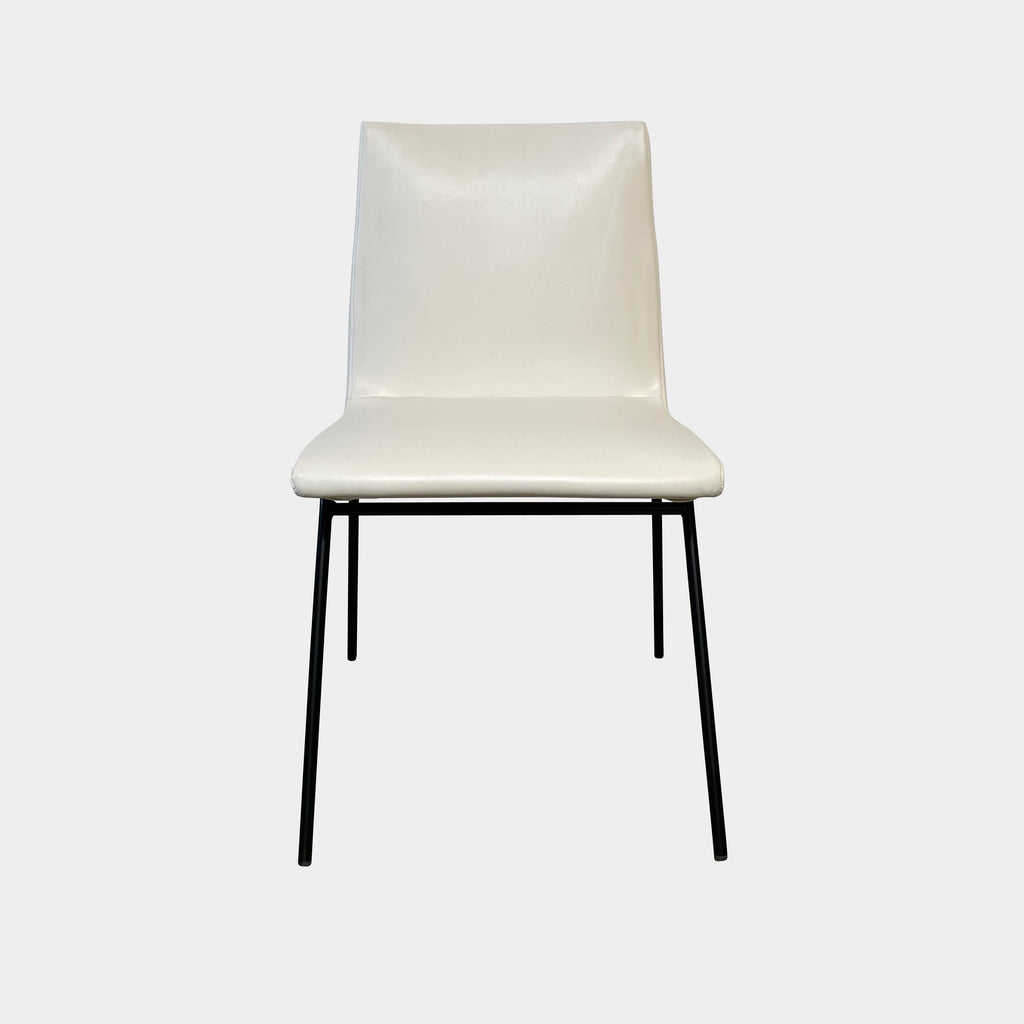 Two white Ligne Roset TV chairs with black legs on a white background.