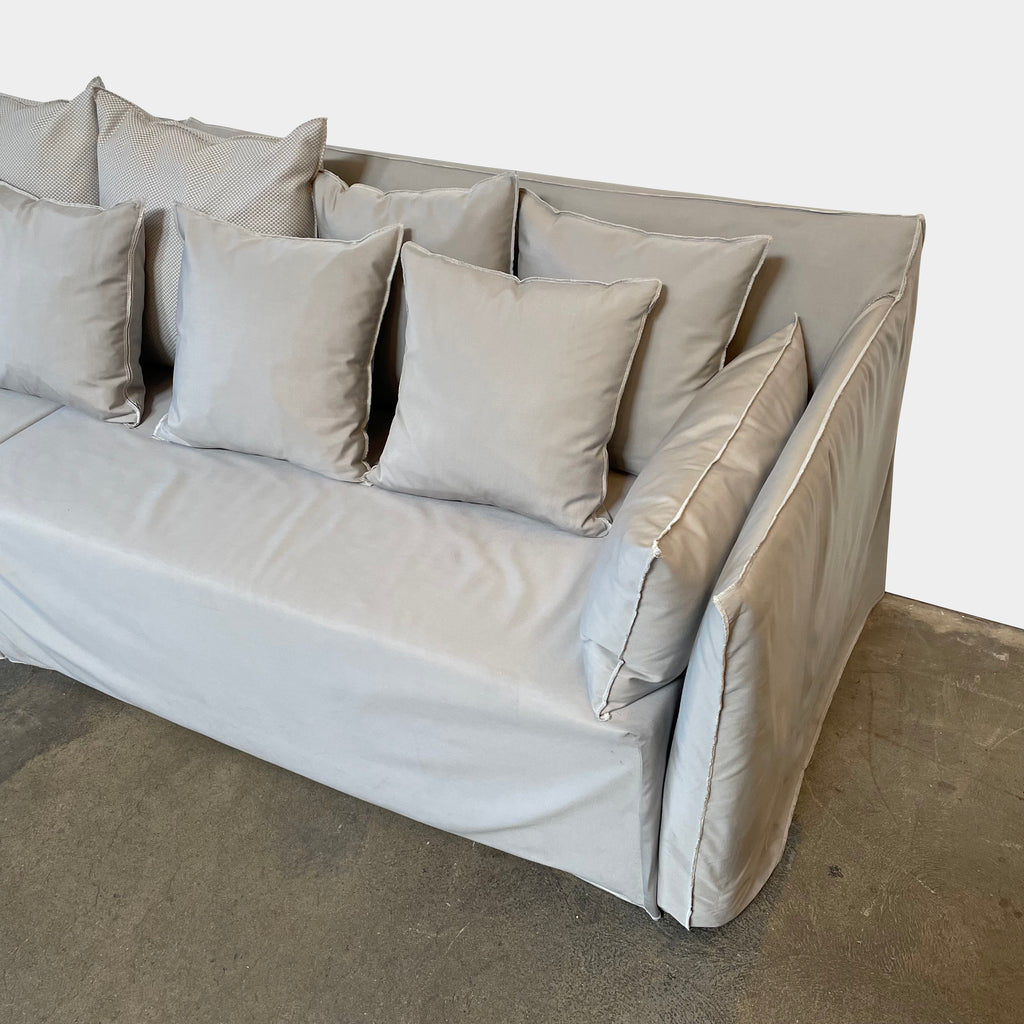 A Gervasoni Ghost Out Outdoor Sofa with pillows on it.