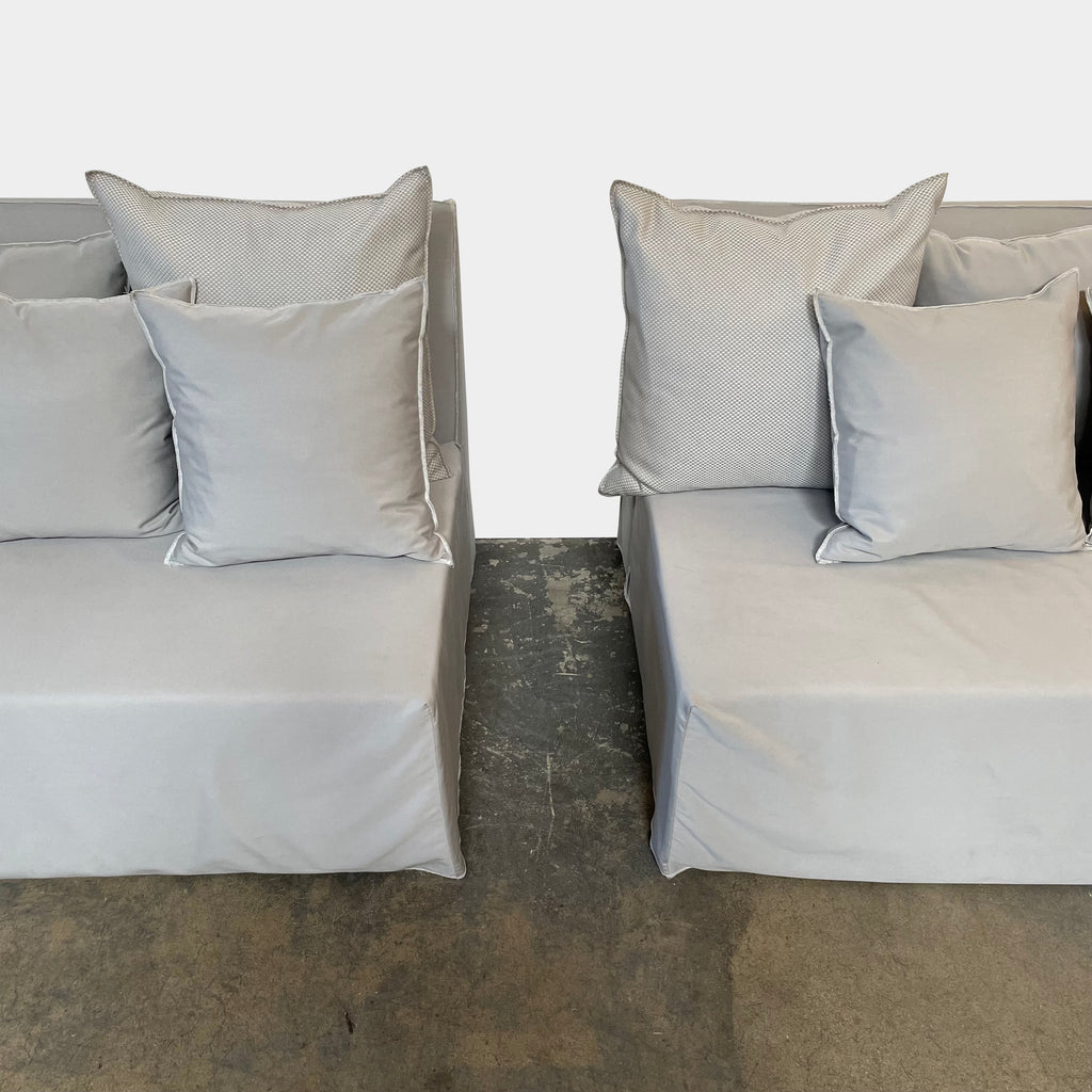 A Gervasoni Ghost Out Outdoor Sofa with pillows on it.