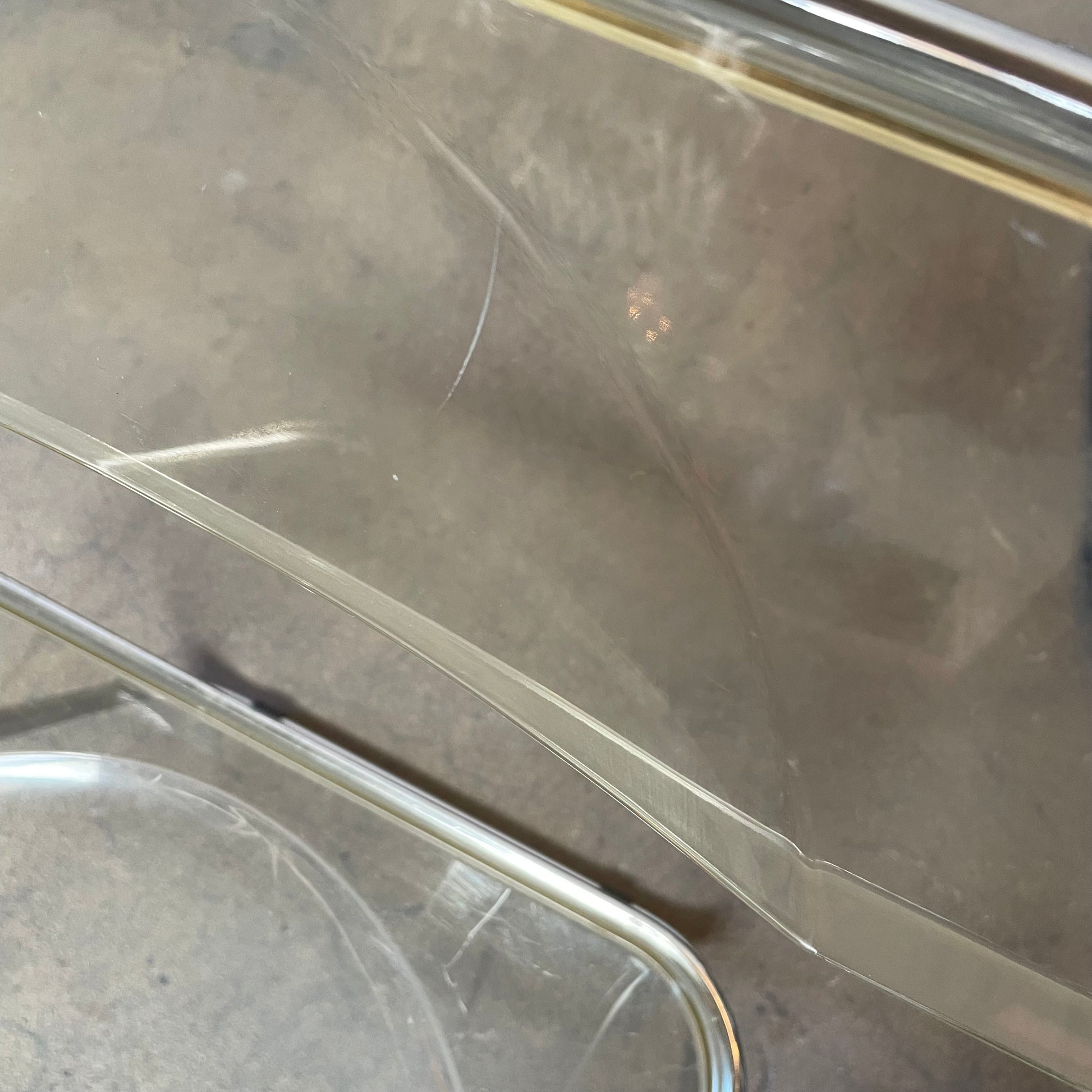 The Anonima Castelli Plia Folding Chair by Castelli, highlighted against a plain white background, echoes the iconic design of Giancarlo Piretti's Plia Folding Chairs and features the innovative "3-disc pin" mechanism.