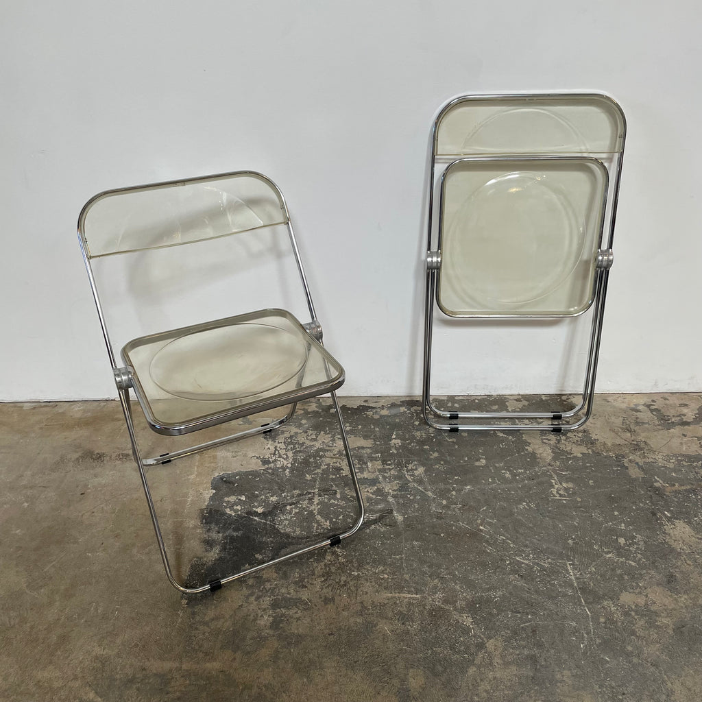 A pair of sturdy Castelli Plia Folding Chairs.