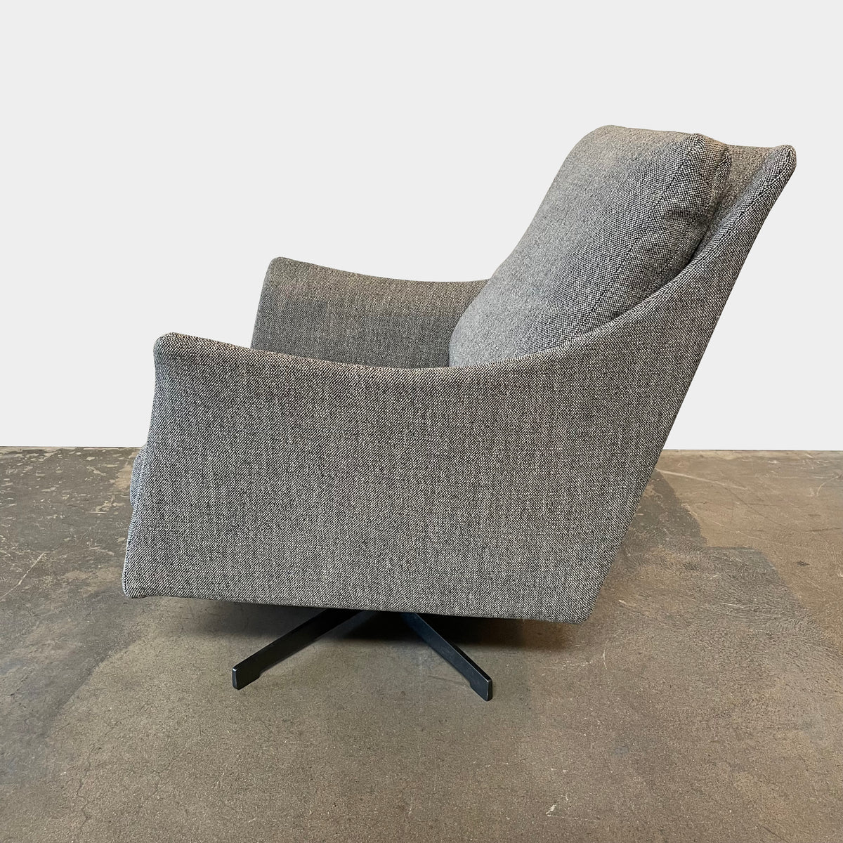 Flexform Boss armchair and ottoman set, upholstered in gray fabric, against a white background.