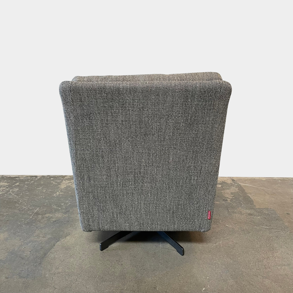 Flexform Boss armchair and ottoman set, upholstered in gray fabric, against a white background.