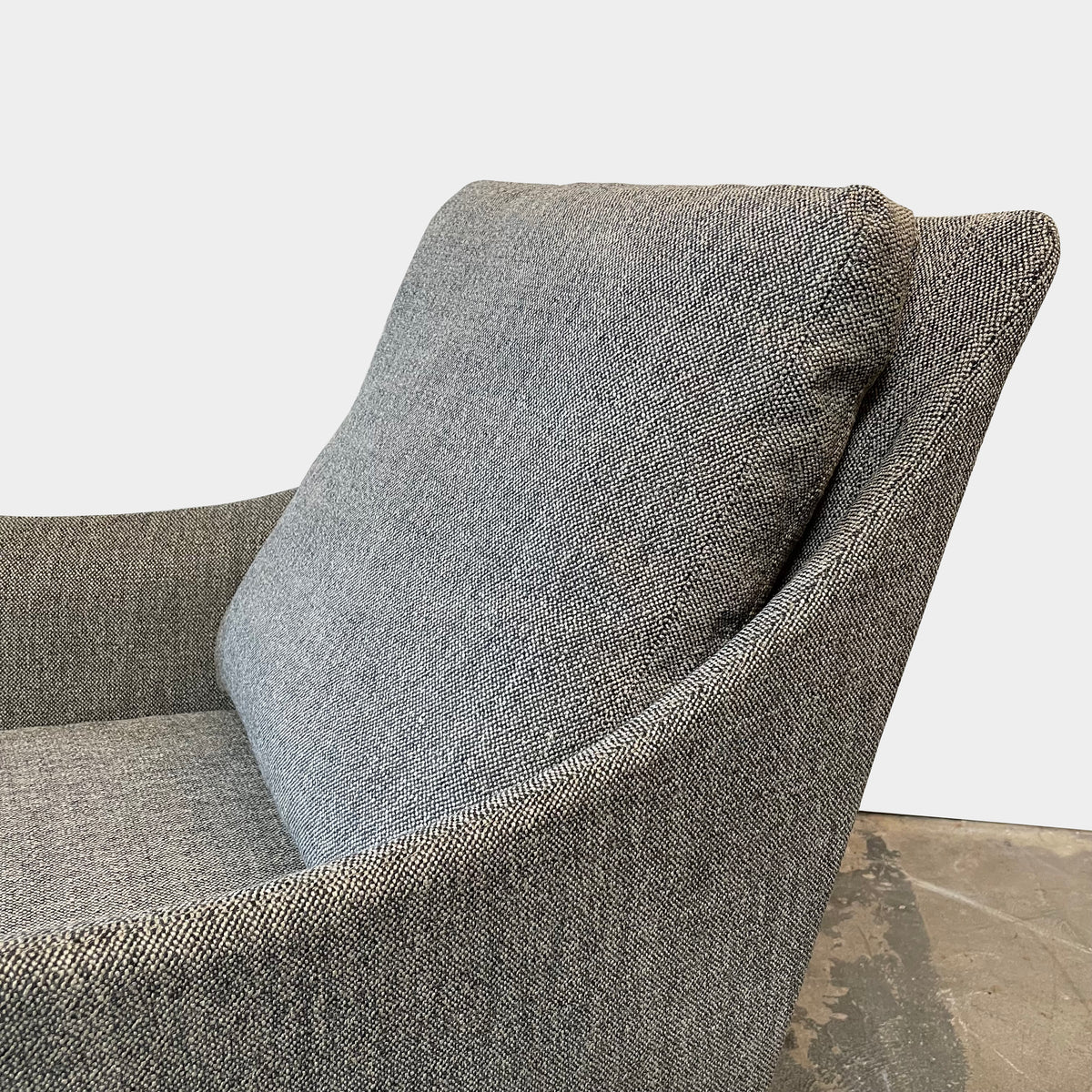 Flexform Boss armchair and ottoman set, upholstered in gray fabric, against a white background.