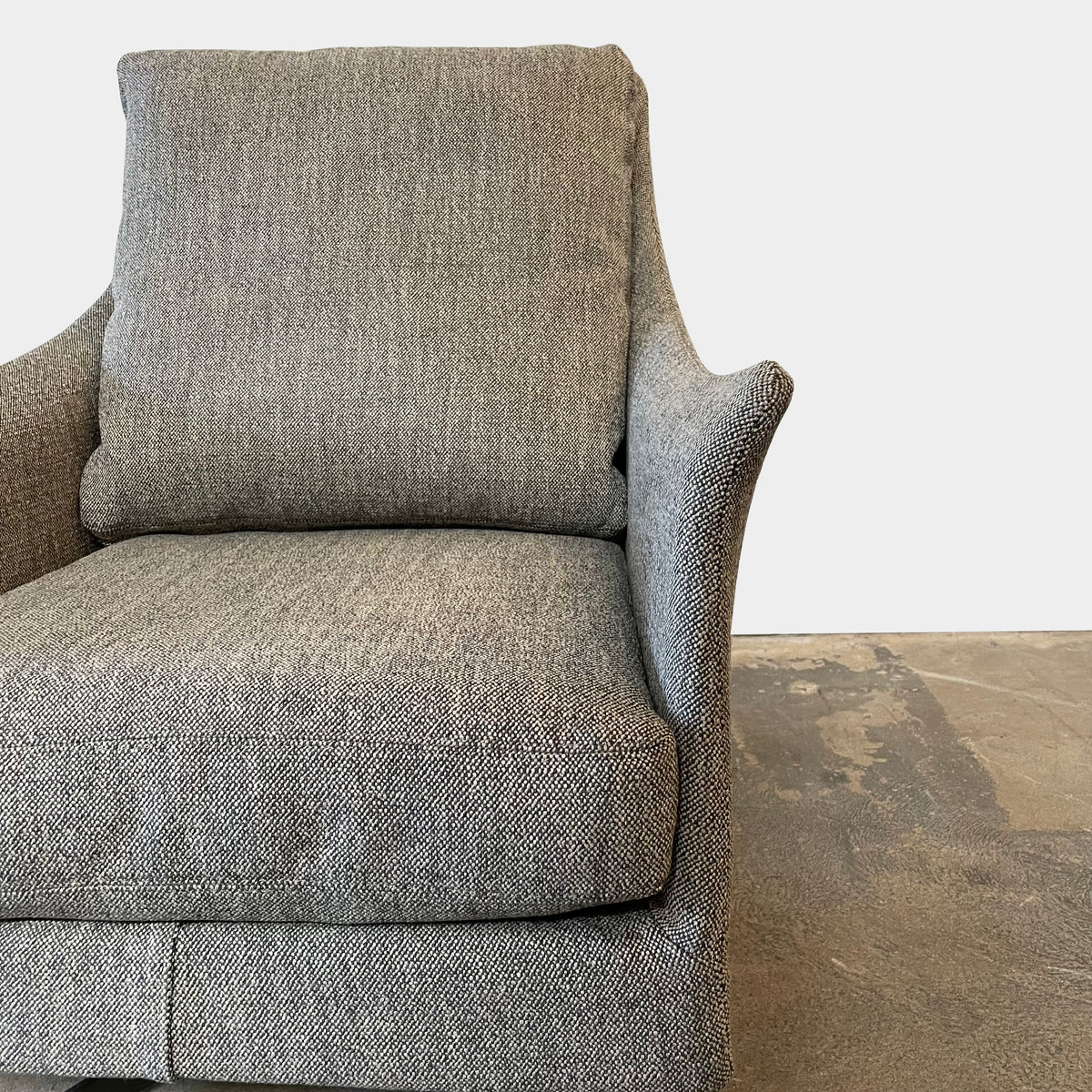Flexform Boss armchair and ottoman set, upholstered in gray fabric, against a white background.