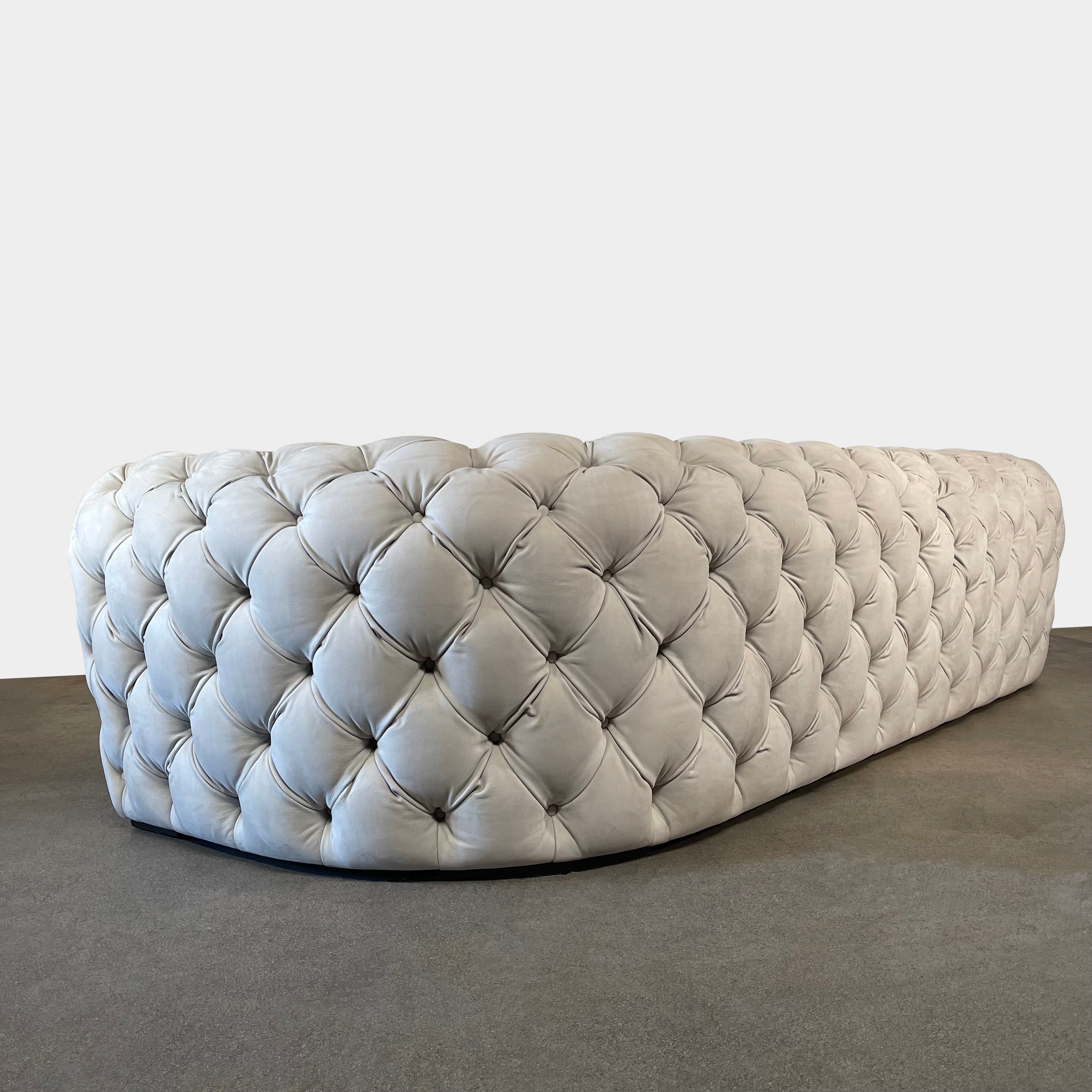 A white Baxter Chester Moon Sofa with a tufted back.
