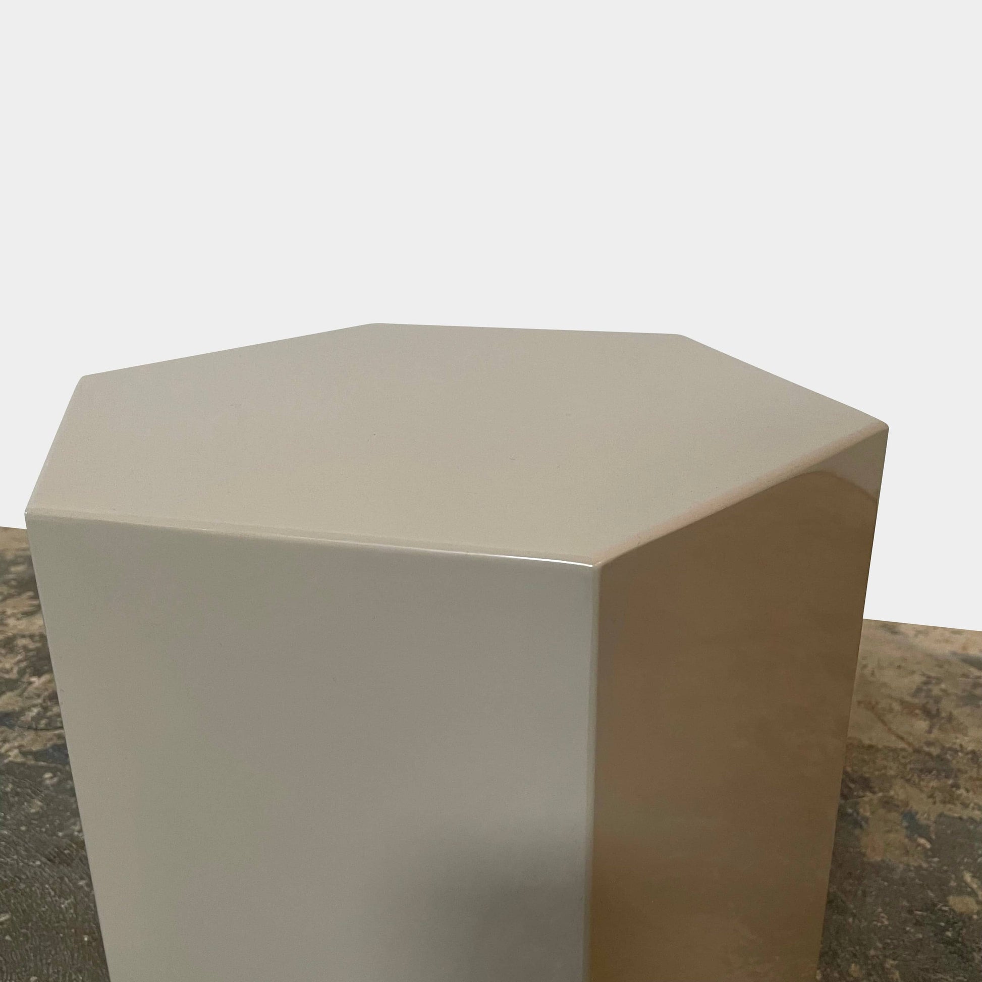 A Minotti Aeron side table on a white background.