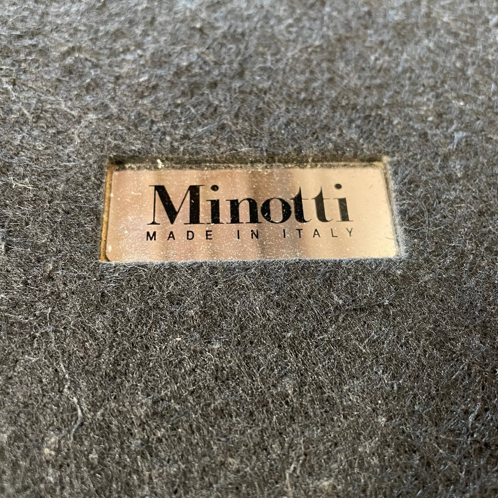 A Minotti Aeron side table on a white background.