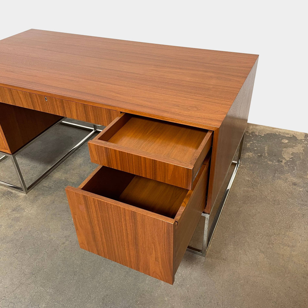 A Maxine Snider Inc. Library Desk with two drawers and a metal base.