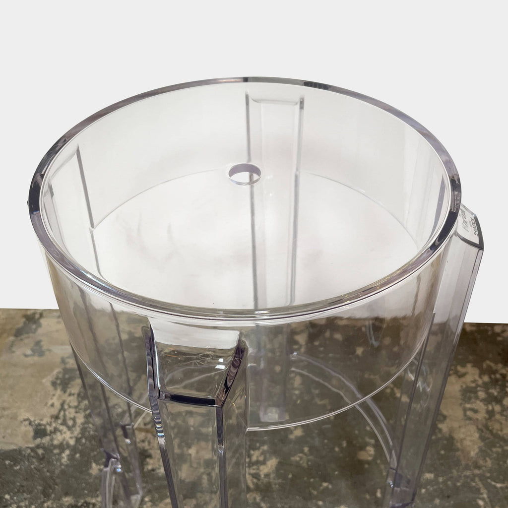 Two transparent Kartell Ghost Stackable Counter Height Stools on a white background.