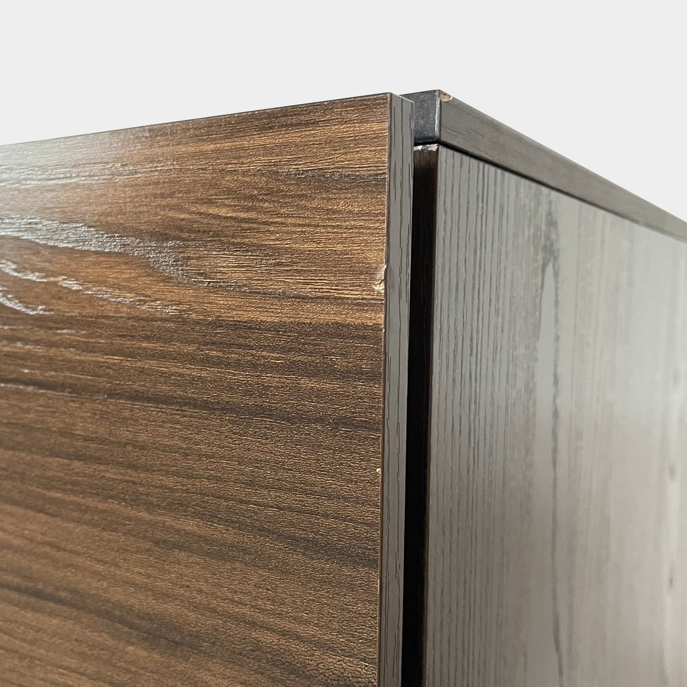 A Dall'Agnese Slim Chest of Drawers with two storage compartments, featuring an oak finish, placed on a white background.