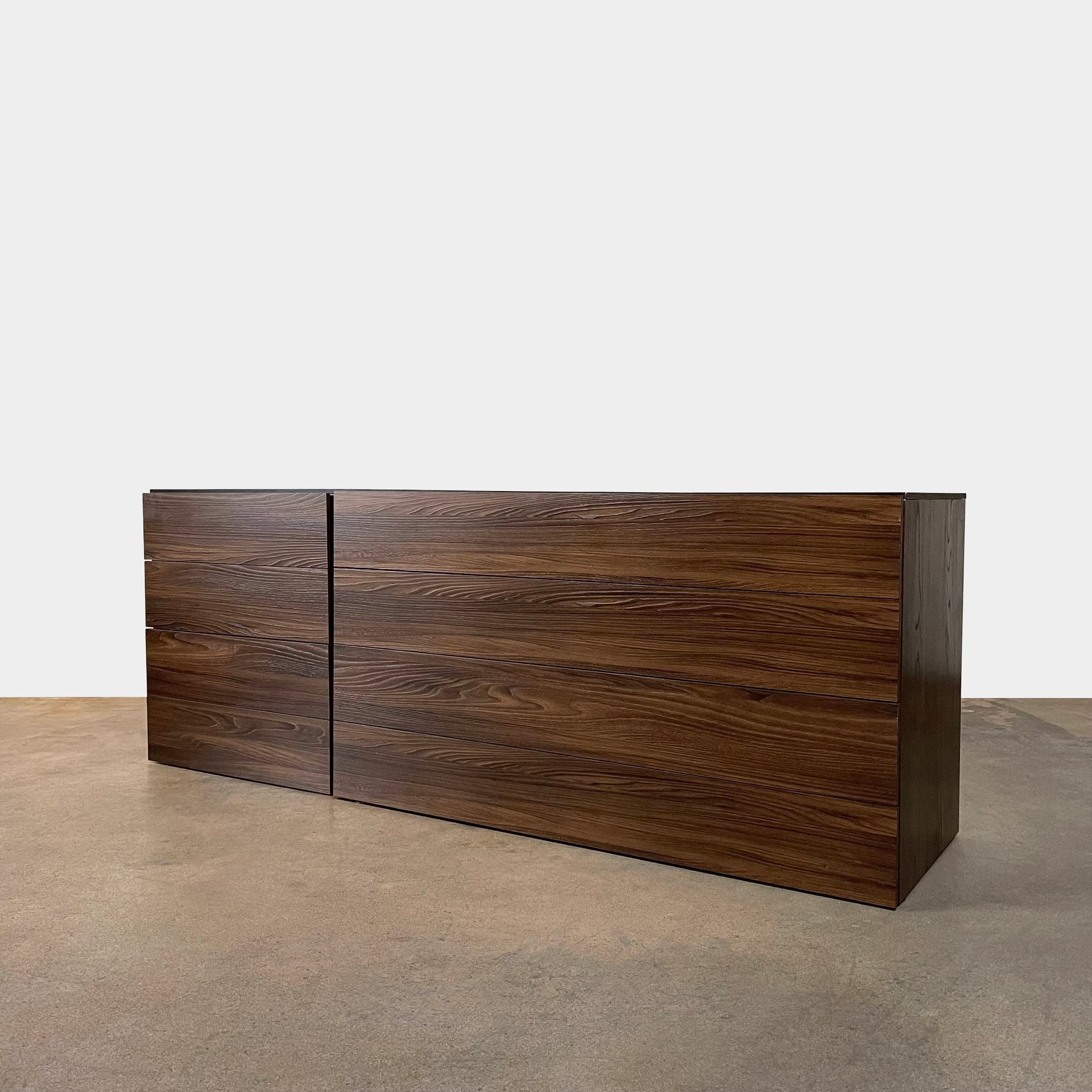 A Dall'Agnese Slim Chest of Drawers with two storage compartments, featuring an oak finish, placed on a white background.