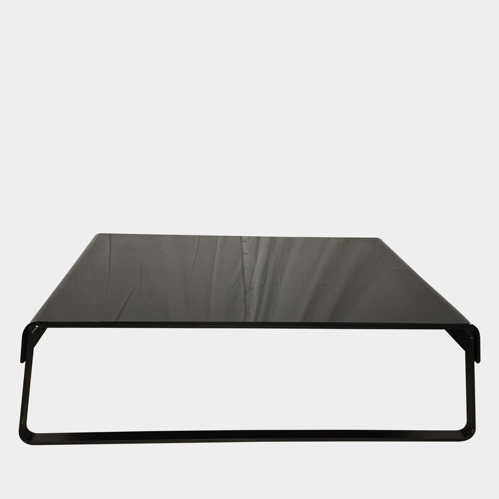 An Artelano Glass-1 coffee table on a white background with a waterfall edge.