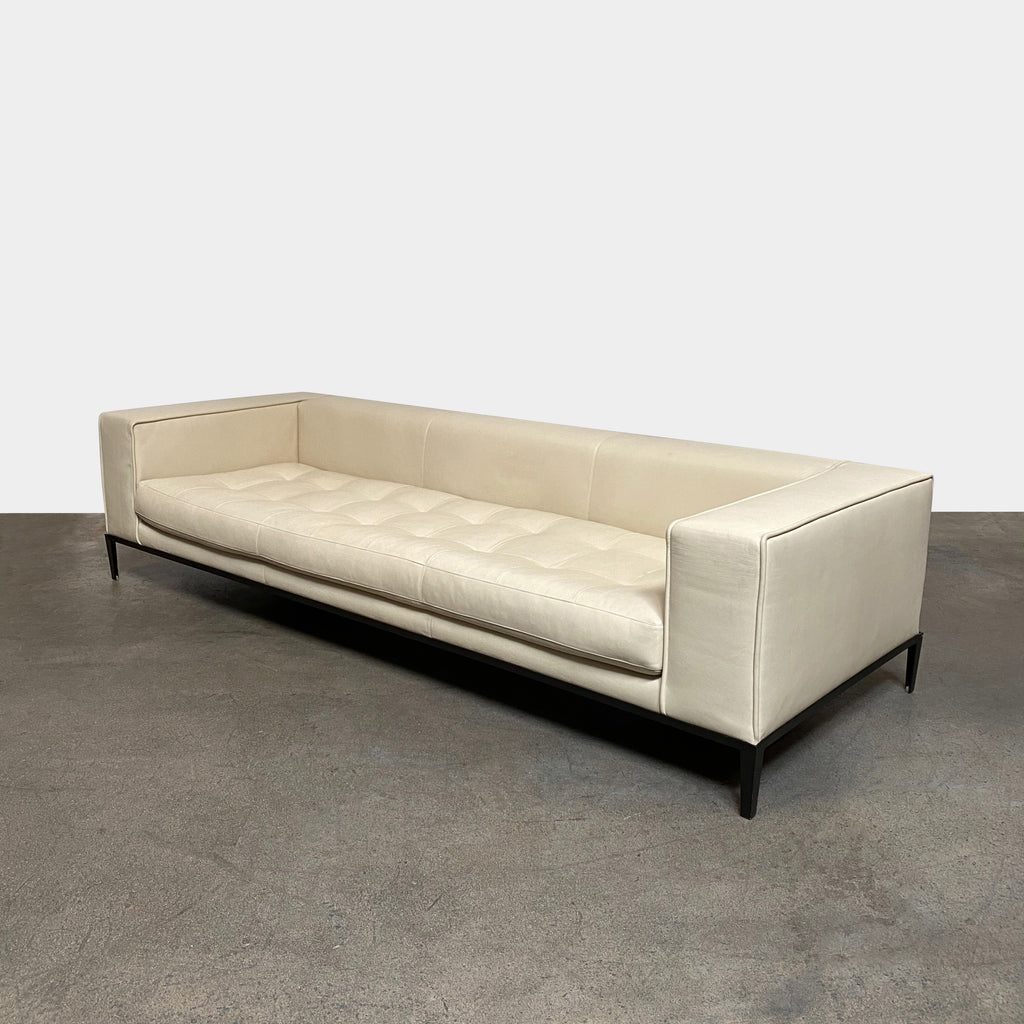 A Maxalto Simplex Sofa with wide structured arms on a white background.