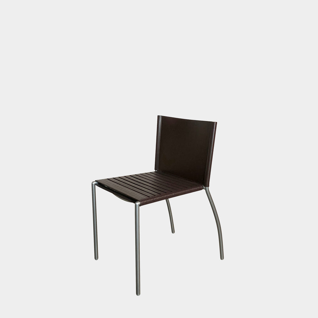 A Ligne Roset Tress Dining Chair in black leather against a white background.