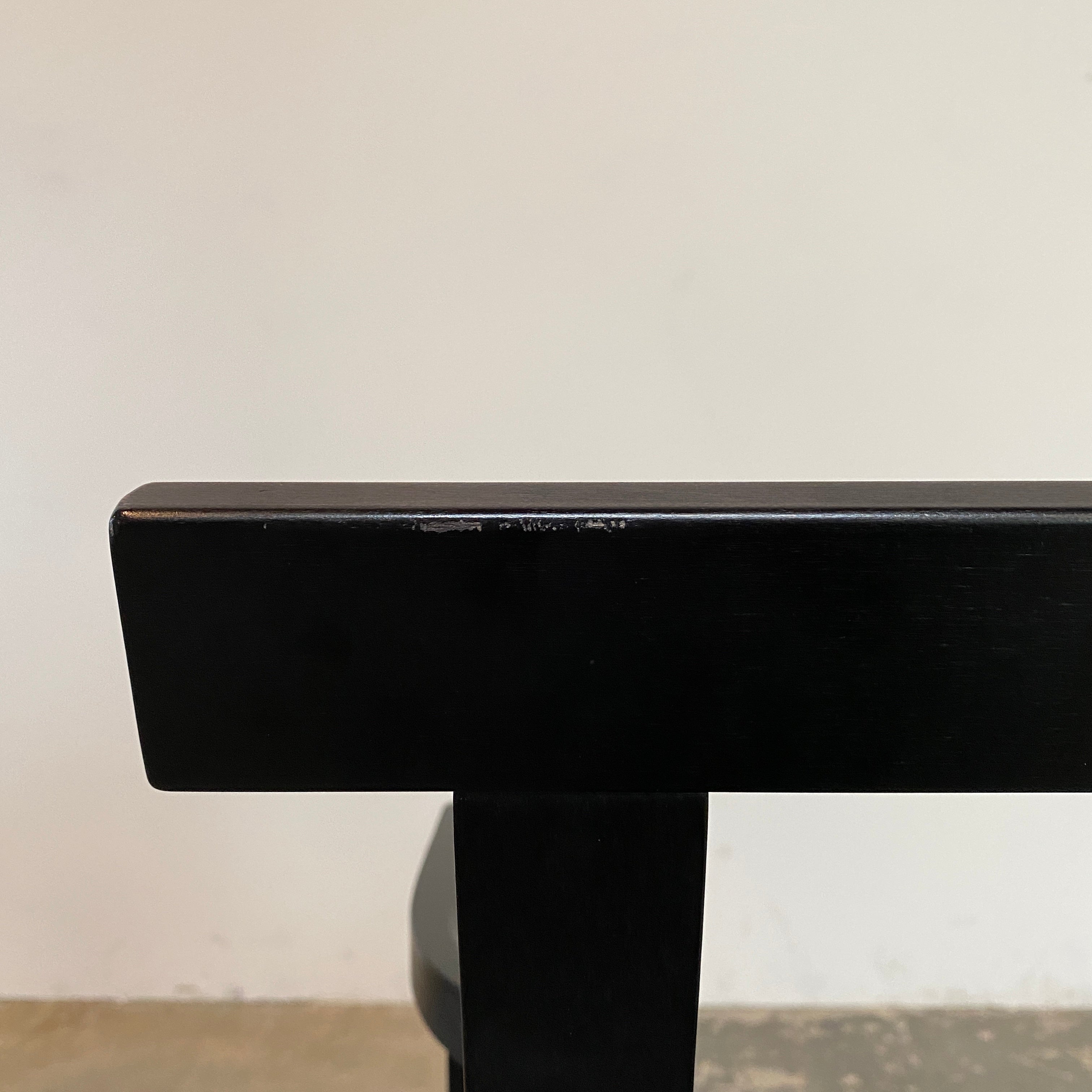 A rare vintage Solitar armchair by John Kandell, crafted in black wood, showcases an angular, geometric design that evokes the Memphis Design movement, displayed against a plain background.