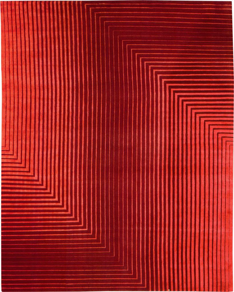 A Delinear Detour Red Silk & Wool Rug 8x10 with zig zag lines on it.
