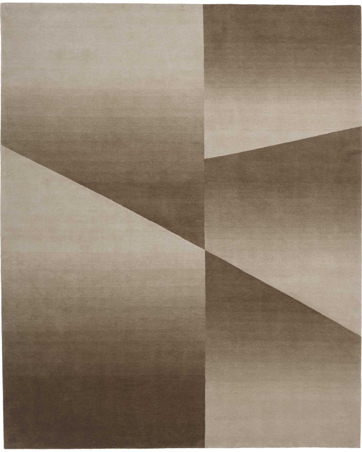 The Delinear Facet Cropped Wool Rug, offered by Delinear, is elegantly positioned on a light gray floor. It showcases modern abstract designs in beige and taupe, with diagonal lines and subtle texture.