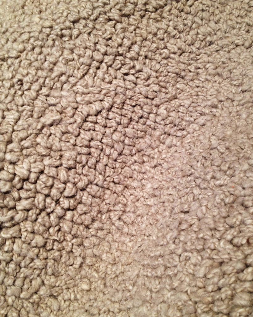 A close up image of a Delinear Macrame Putty Grey Shag 8'X10' Rug.