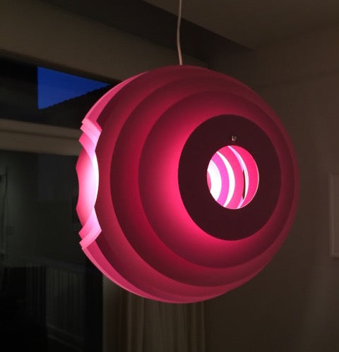 Modern Foscarini Supernova purple pendant light with concentric circular design.